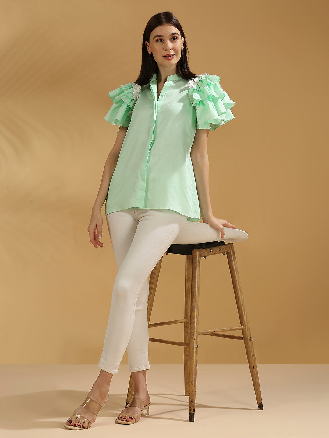 Ice blue ruffle shirt.