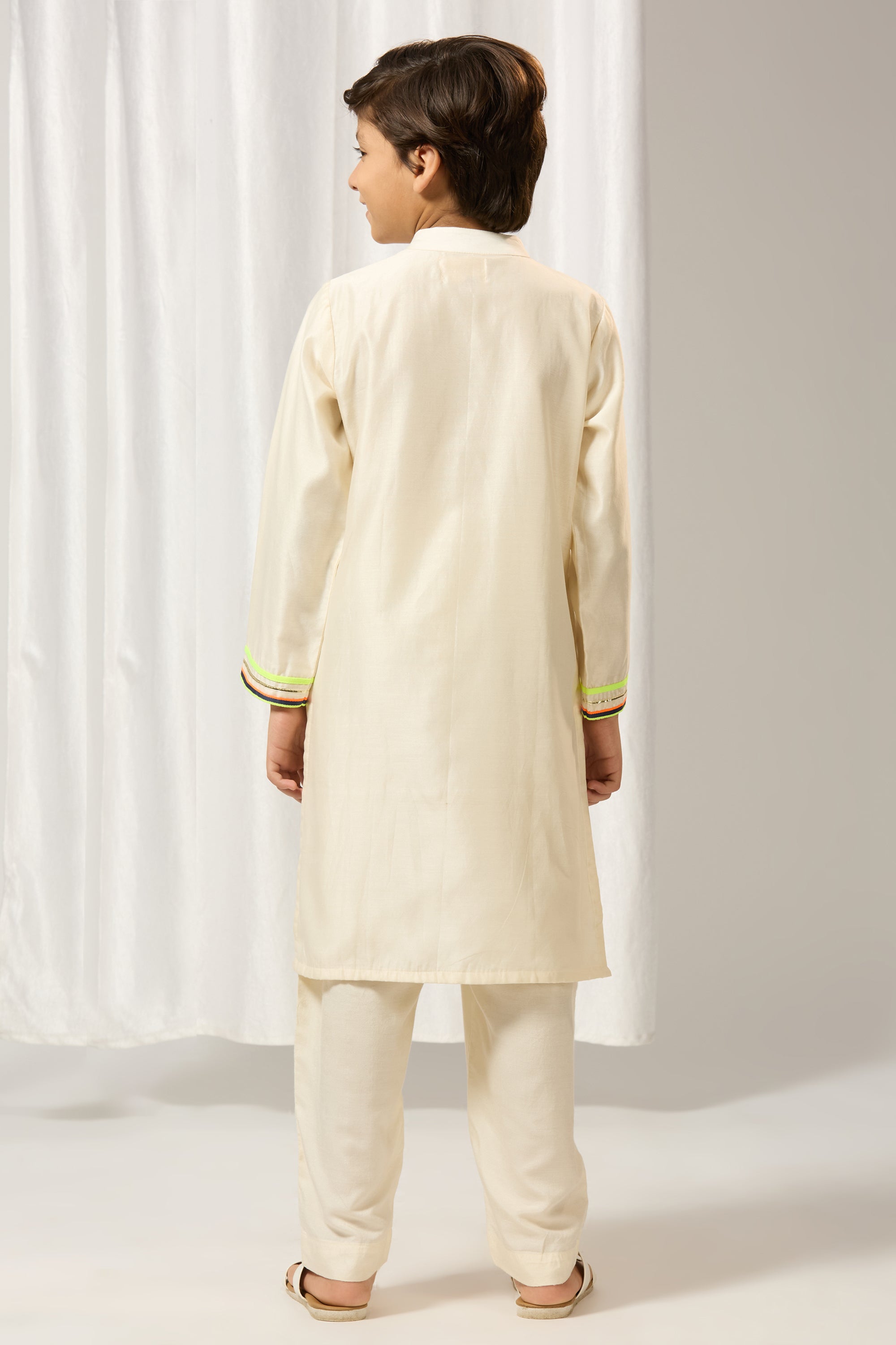 Ivory chanderi gota kurtaset.