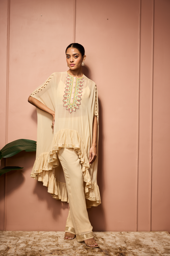 BEIGE RUFFLE CAPESET.