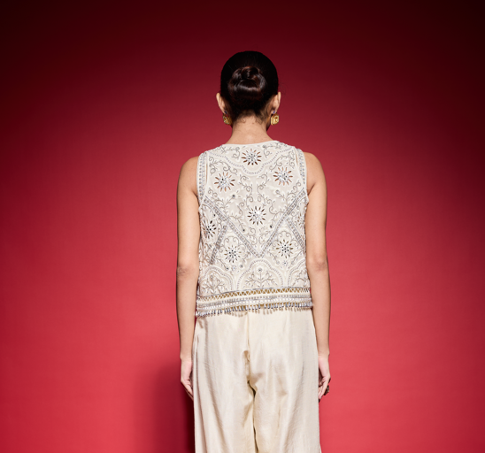 WHITE EMBROIDERED CUTOWRK VEST.