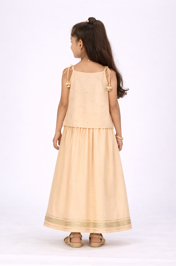 Custard tieup embroidered lehengaset.