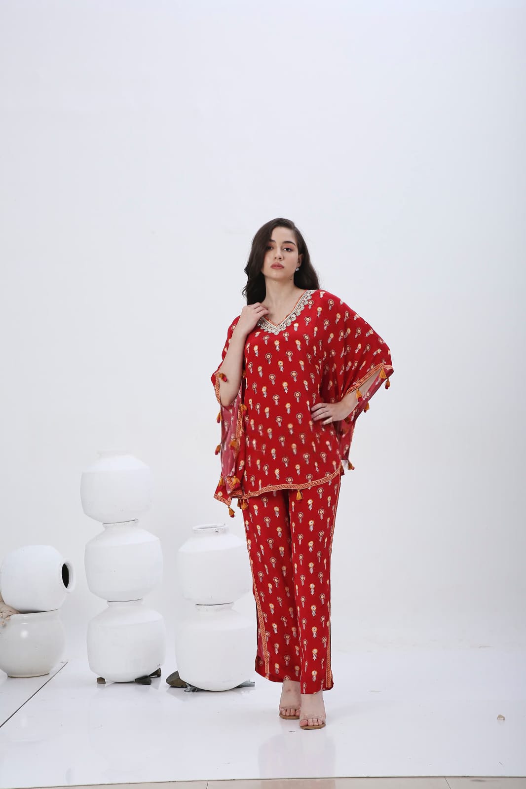 Red mela kaftan co-ordset with tessels.