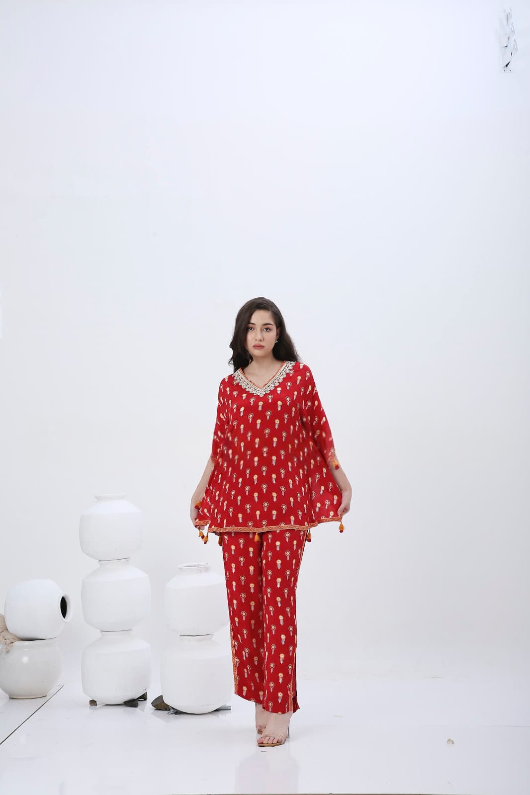 Red mela kaftan co-ordset with tessels.