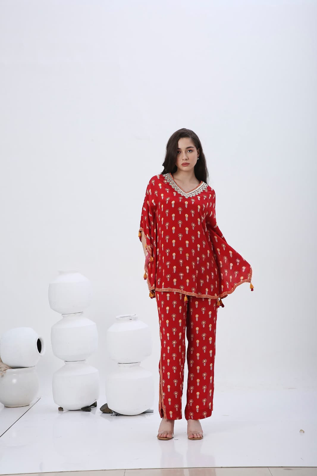 Red mela kaftan co-ordset with tessels.