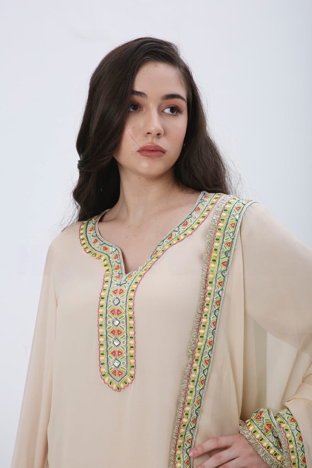 Beige colorful embroidered kurtaset.