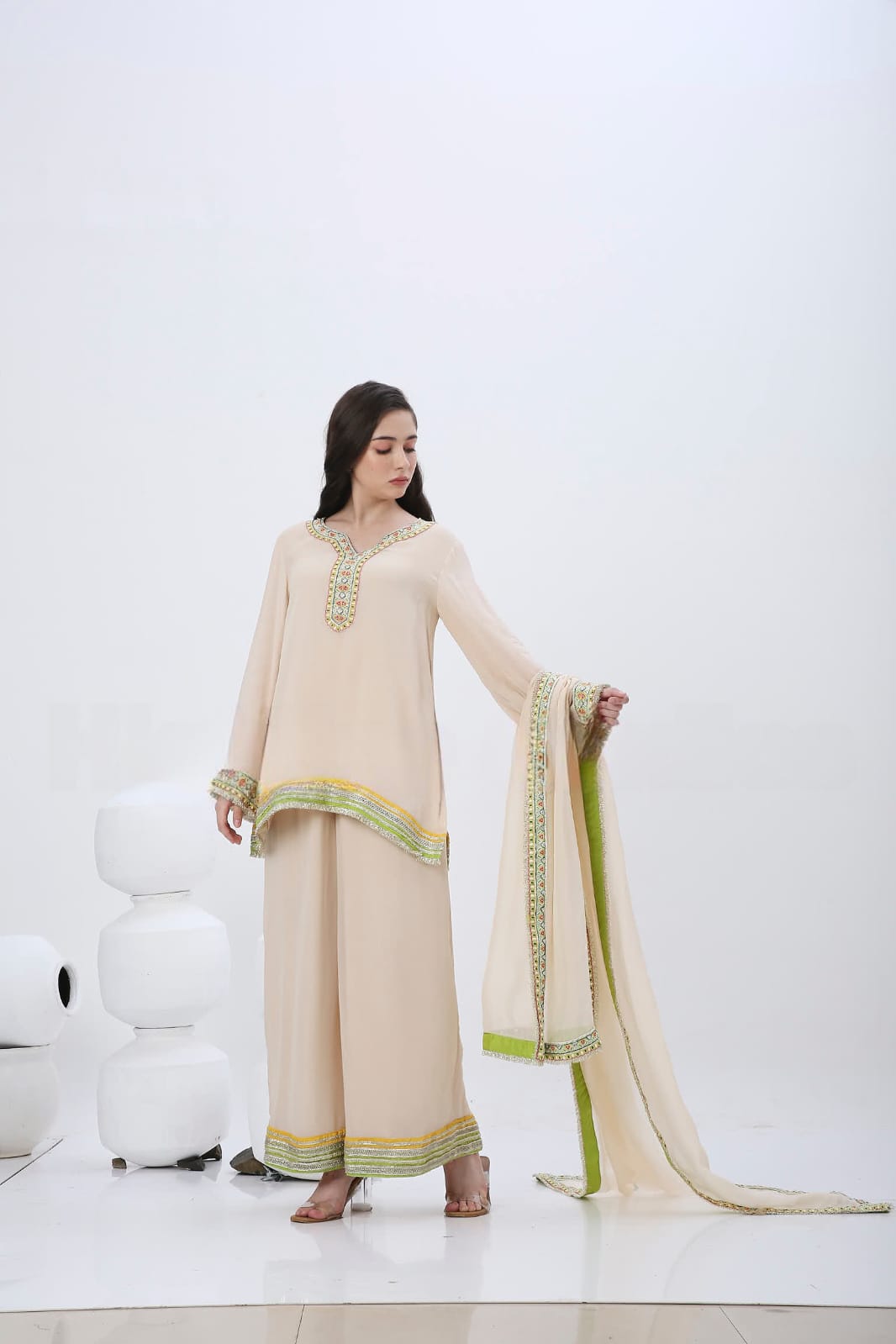 Beige colorful embroidered kurtaset.