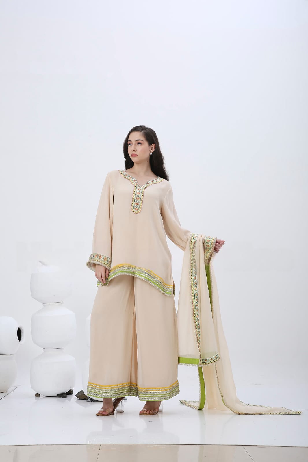 Beige colorful embroidered kurtaset.