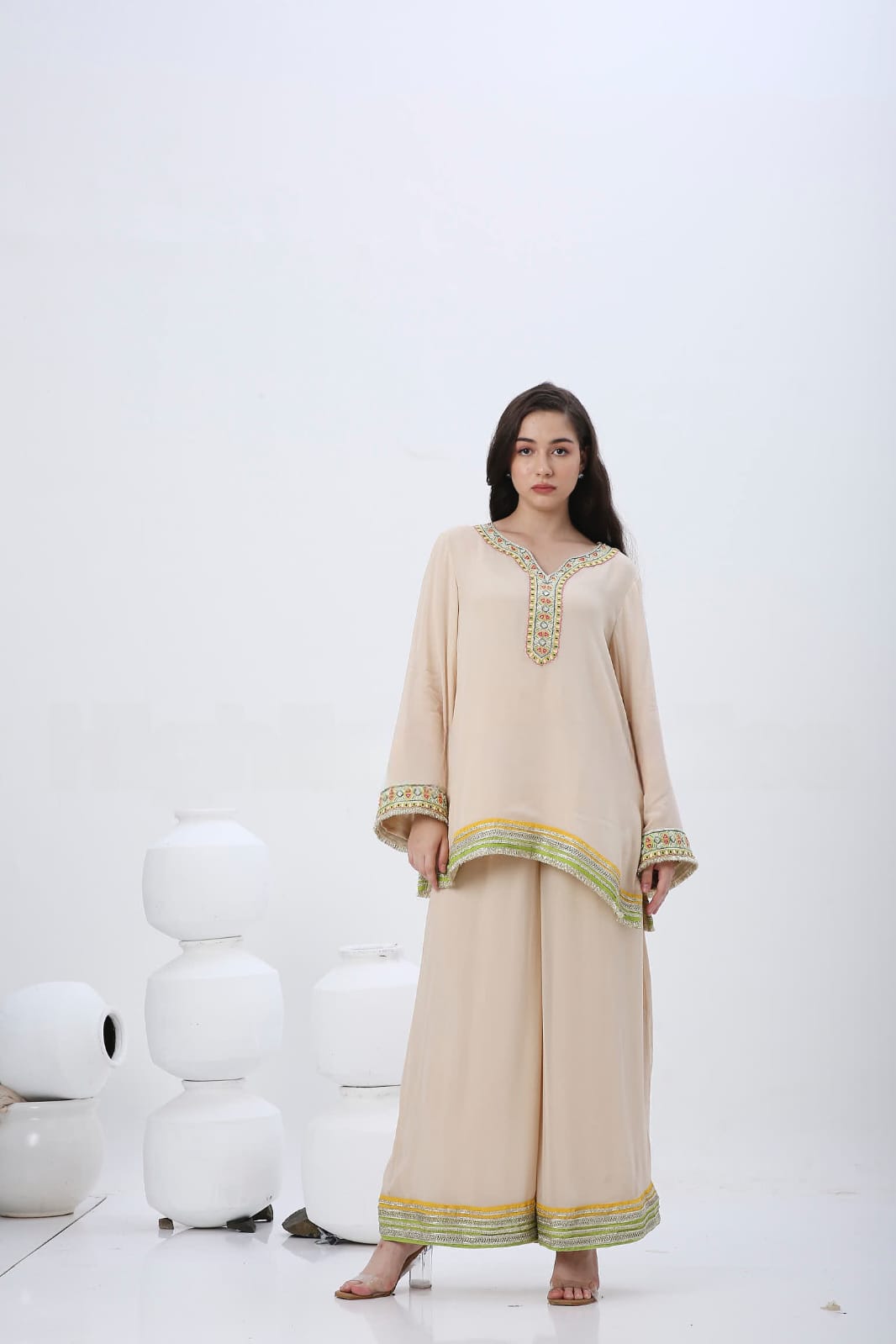 Beige colorful embroidered kurtaset.