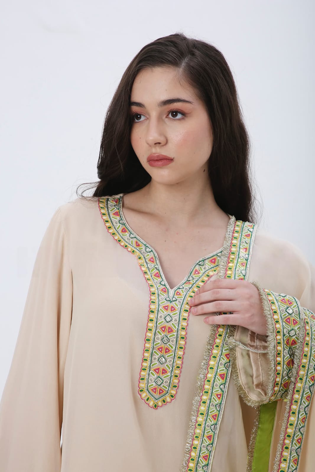 Beige colorful embroidered kurtaset.