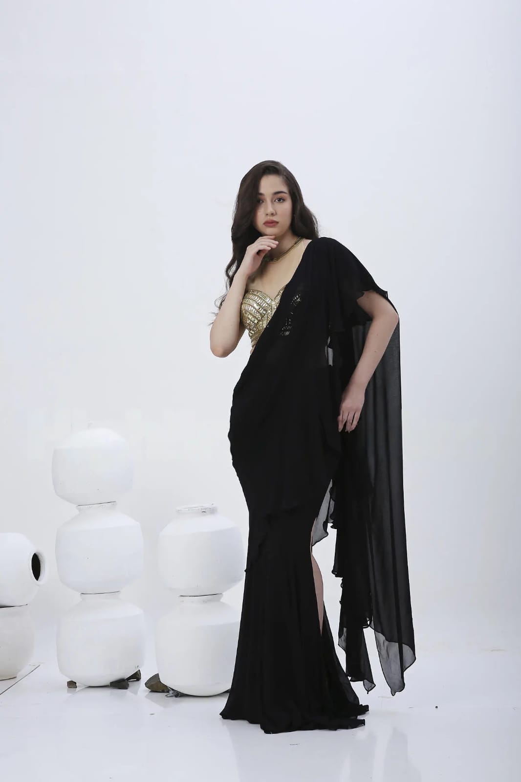 black prestiched ruffle saree.