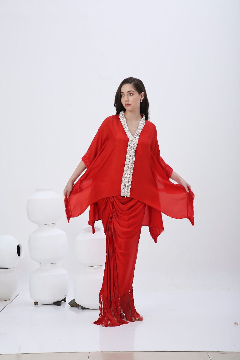 Red fringe kaftan with fringe skirt.