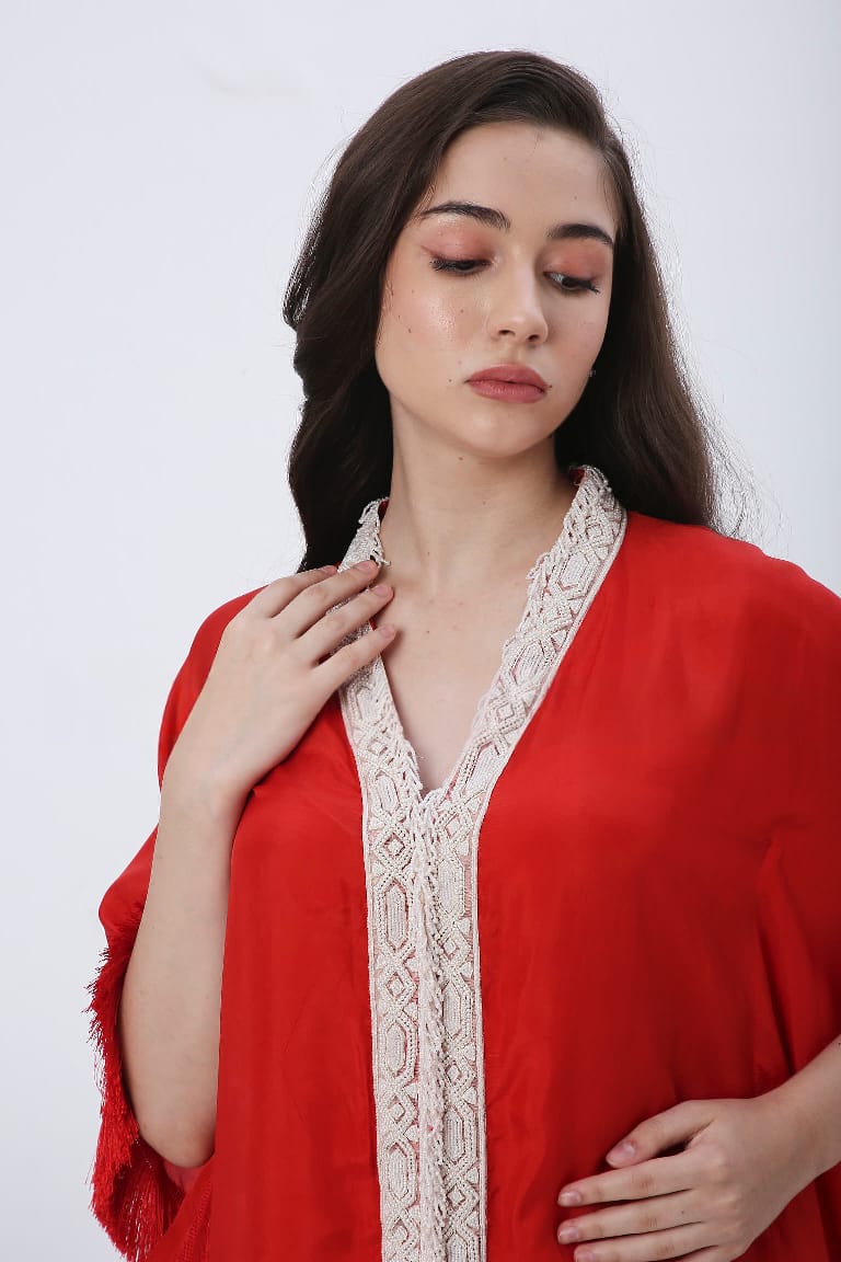 Red fringe kaftan with fringe skirt.