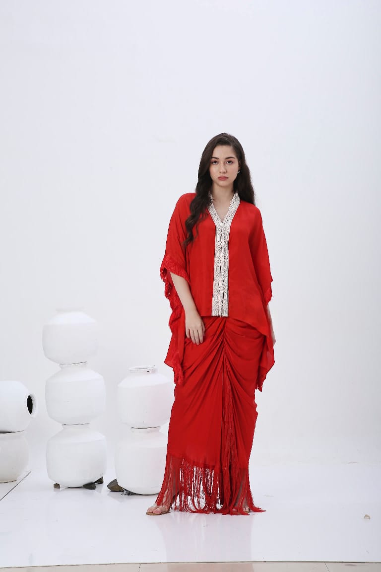 Red fringe kaftan with fringe skirt.