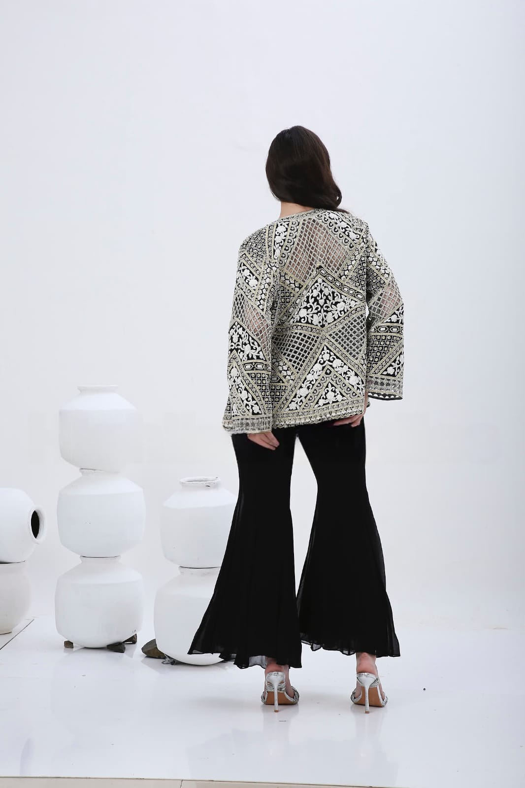 Black floral cutwork jacket .